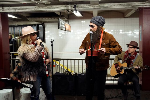 Alanis and Jimmy busking in disguise